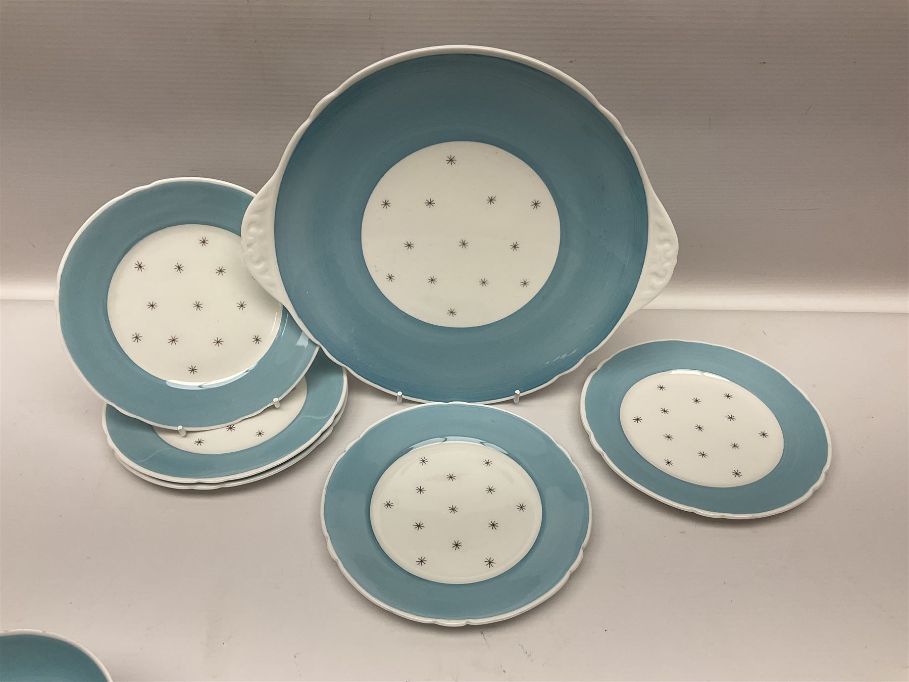 Shelly Pole Star pattern tea service for five comprising teapot, milk jug, open sucrier, cups and saucers, dessert plates and one cake plate 