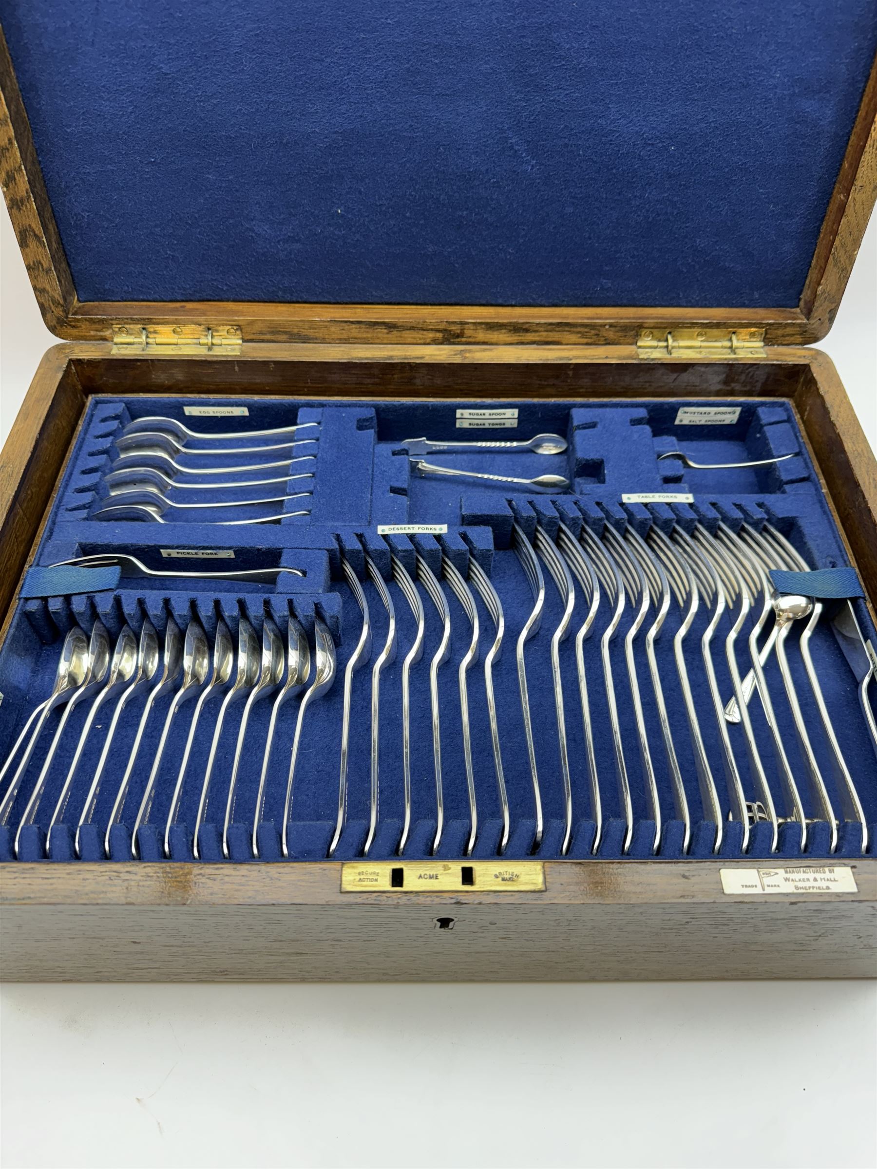 Walker & Hall canteen of plated cutlery for for twelve place settings, all knives with ivory effect handles, within an oak canteen case with a brass shield to the lid, with key, case  