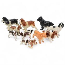 Royal Crown Derby paperweight American Spaniel with gold stopper, together with Beswick an...