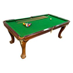 Riley - mahogany slate bed snooker dining table, green baize playing surface fitted with leather net pockets, raised on cabriole supports ending in ball and claw feet; together with set of Riley cues, balls and scoreboard