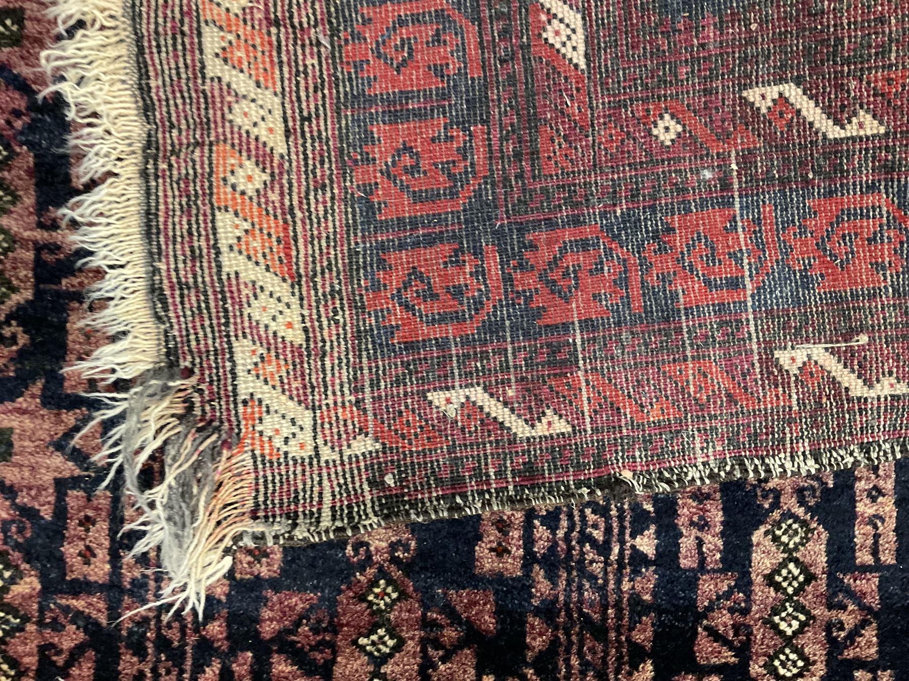 Bauchi prayer rug, dark indigo ground with overall geometric design within a flat arch border, multiple border bands with repeating geometric patterns