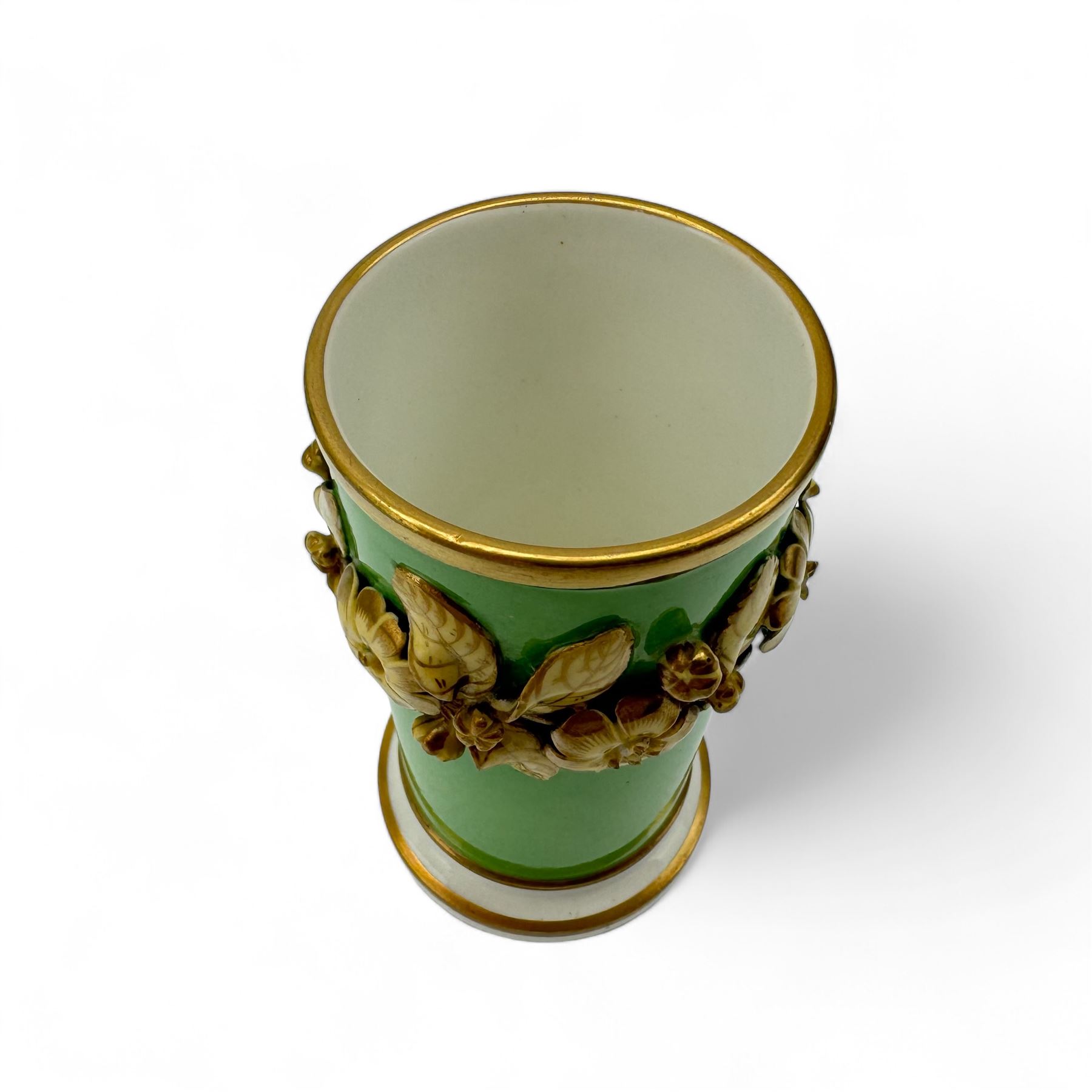 19th century bottle vase and associated cover, the body hand painted with a view of Inveraray Castle, against a green ground, H24cm, pair of green ground spill vases, with floral encrusted banding, H10cm, together with a pair of green ground candlesticks, probably Coalport (5)