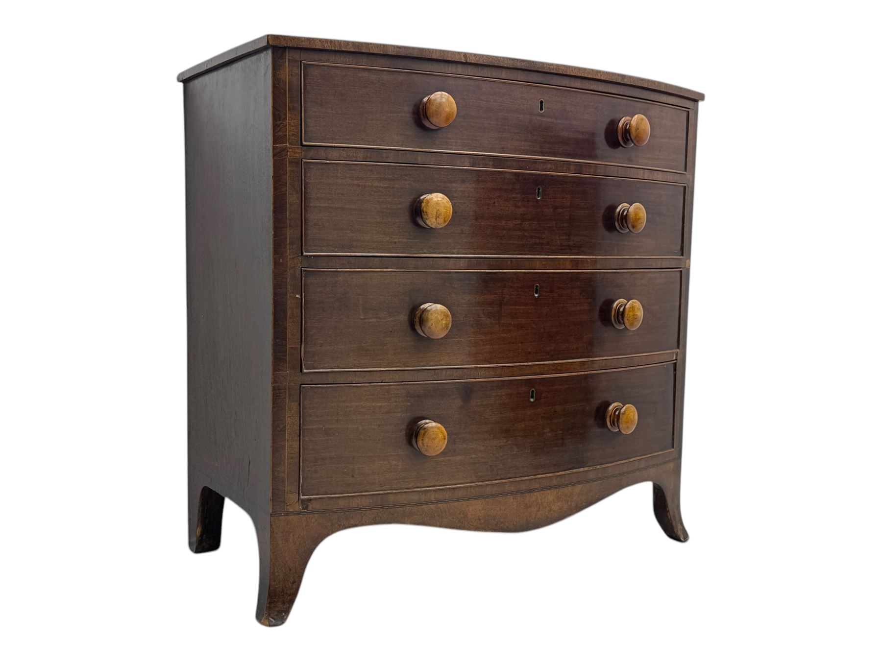 Victorian mahogany bow-fronted chest, fitted with four long graduating cock-beaded drawers, shaped apron on splayed bracket feet