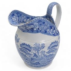 Three 19th century blue and white transfer printed jugs, two of helmet form, the other with basket weave moulded base, together with a 19th century blue and white meat plate, L52.5cm (4)