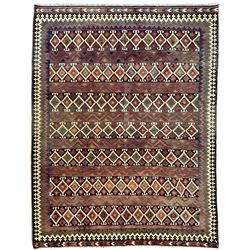 Northeast Persian Sumak Kilim red ground rug, the field decorated with rows of multicoloured diamond motifs featuring  geometric patterns, the border composed of alternating black and white stepped designs, enclosed by a narrow band with multicoloured geometric shapes