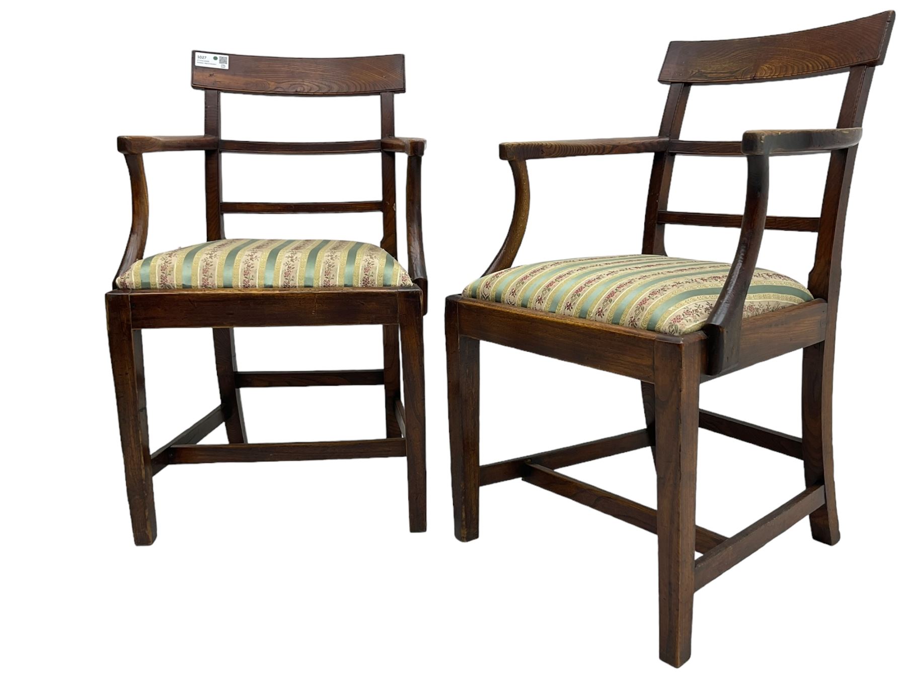 Pair of 19th century elm elbow chairs, bar back over horizontal rails, drop-in seats upholstered in striped fabric, on square tapering supports united by stretchers