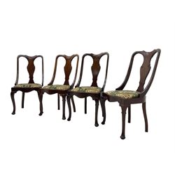 Set of eight late 19th century mahogany spoon back dining chairs, each with shaped top rail over Queen Anne design vase-shaped splat, upholstered seats in floral patterned fabric, raised on cabriole supports with scroll carved knees