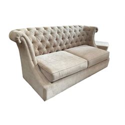 Grande wing back sofa bed, upholstered in beige buttoned fabric, metal action pull out double bed