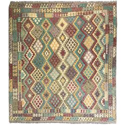 Anatolian Kilim cream ground rug, decorated with repeating diamond motifs in red, blue, ye...