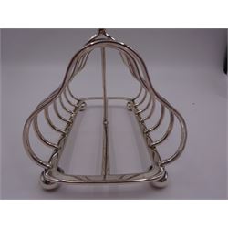 Victorian silver seven bar toast rack, each bar of trilobed form, with similar loop handle and upon four bun feet, hallmarked John Gilbert, Birmingham 1863, H16.5cm