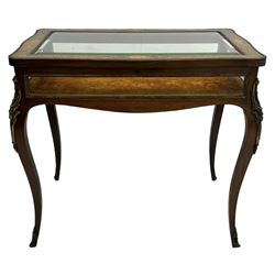 Victorian inlaid rosewood bijouterie table cabinet, shaped form, enclosed by hinged bevel glazed lid with shell and floral inlays, fabric lined interior, glazed sides within foliate cast gilt metal edging, on cabriole supports with floral cast gilt metal mounts and terminal caps 