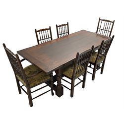 Oak refectory dining table, rectangular cleated top on turned supports joined by H-stretcher; together with set of six (4+2) oak spindle back dining chairs, with upholstered drop-on seat cushions, turned supports joined by turned stretchers