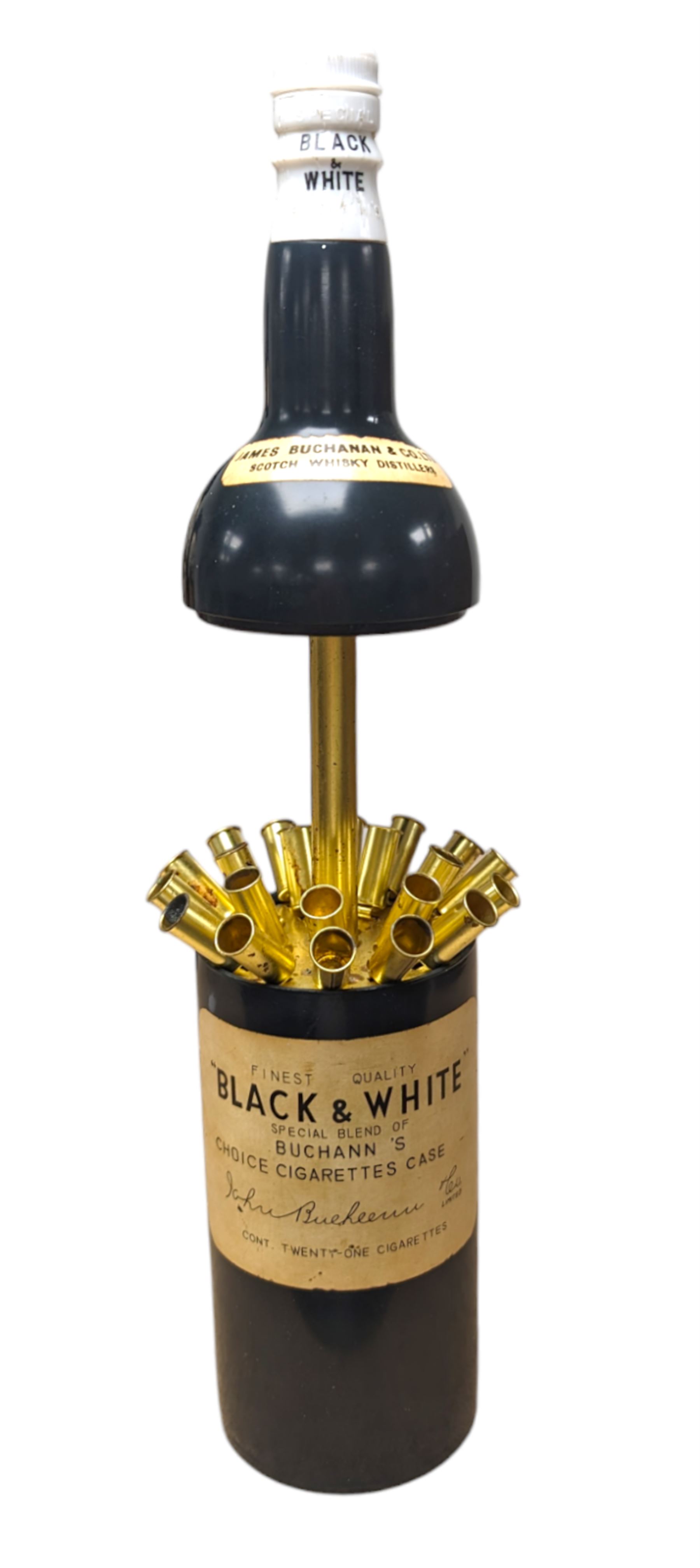 Novelty musical cigarette dispenser, in the form of a Black & White whisky bottle, H28cm