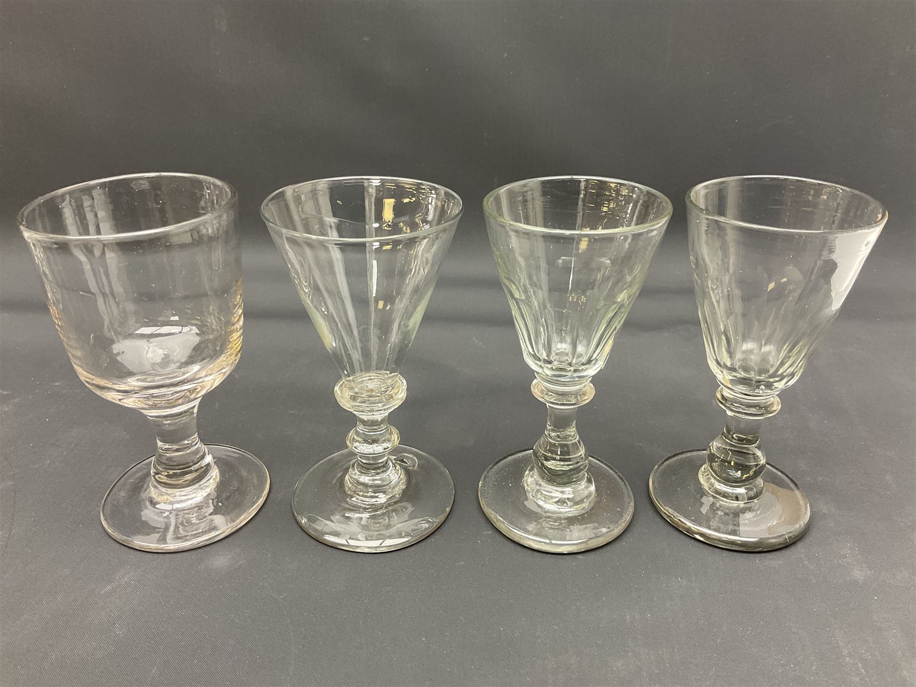 Collection of 18th century and later glassware, including set of three with twist stems and etched and fluted examples