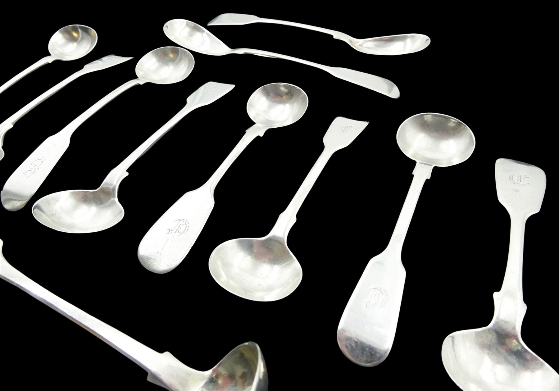 Collection of eleven silver Fiddle pattern salt spoons, comprising a matched set of four Victorian examples, hallmarked Thomas Sewell I, Newcastle 1863 and 1867, three further Victorian examples, hallmarked Reid & Sons, Newcastle 1840, a single Victorian example, hallmarked Newcastle 1841, makers mark worn and indistinct, a Victorian pair, hallmarked Reid & Sons, Newcastle 1843, and a William IV example, hallmarked William Rawlings Sobey, Exeter 1833, approximate total weight 4.27 ozt (133 grams)