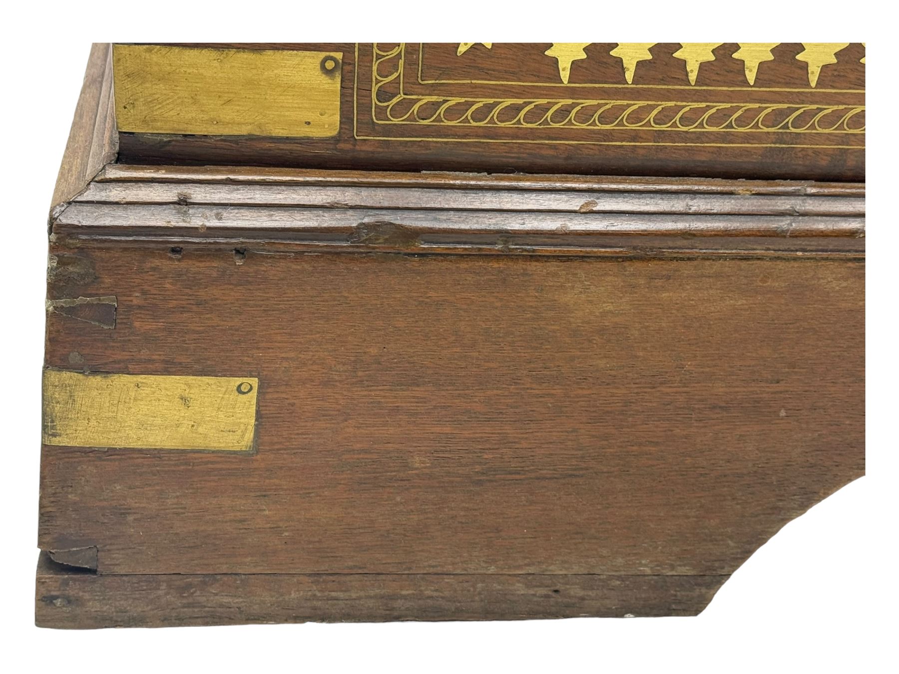 20th century mahogany chest, rectangular hinged top enclosing removable compartments with carved starburst motifs with linear and geometric patterns, brass inlay to the top and front, mounted corners and edges, on bracket base