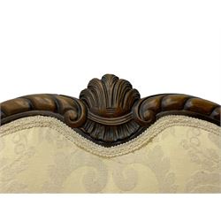 Victorian design walnut framed settee, shaped camelback with gadroon carved edge and central feather motif, upholstered in cream damask fabric with scrolling floral pattern, S-scroll arm facias carved with flower head and curled leaves, feather carved C-scroll splayed feet 