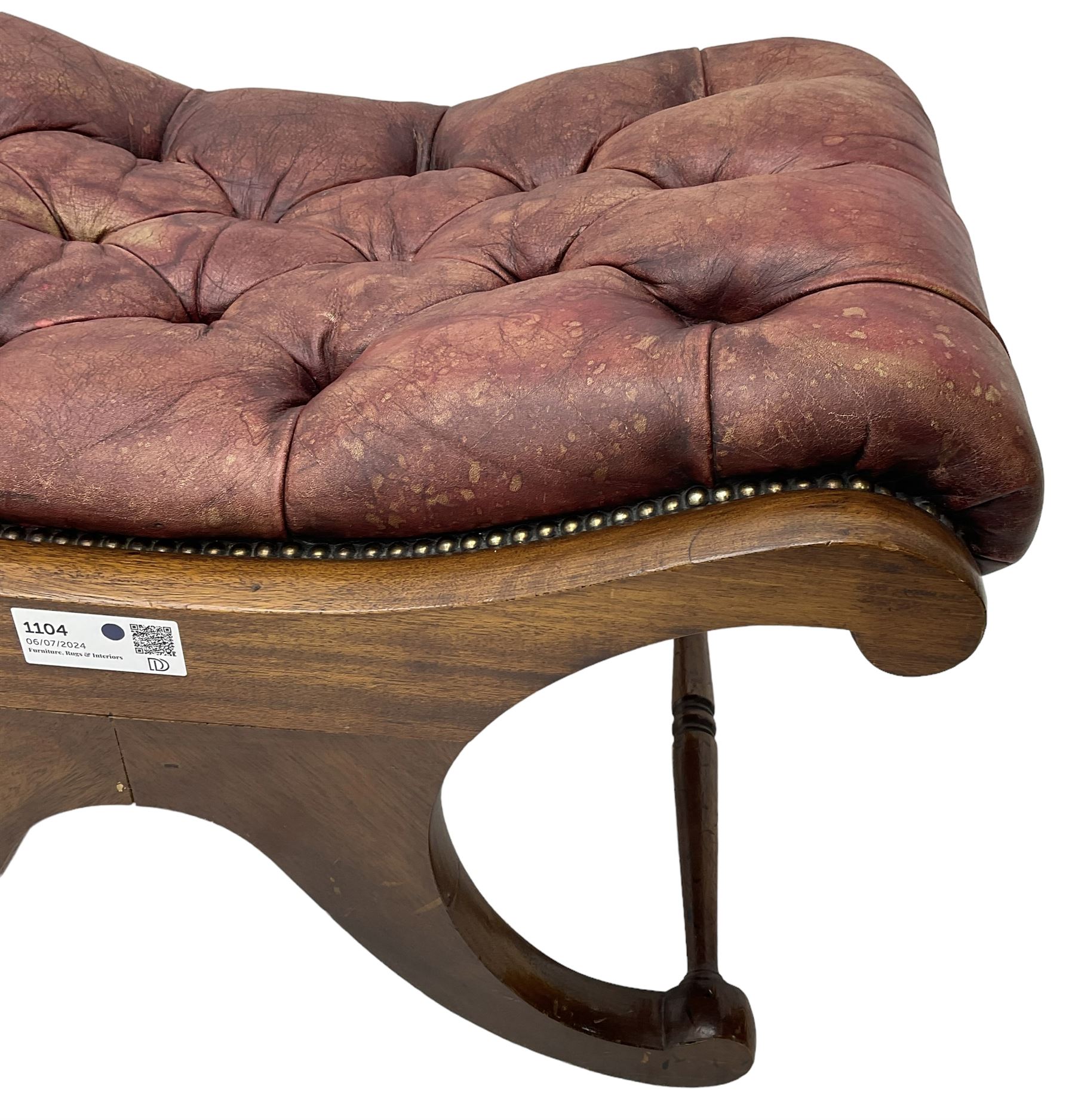 Late 20th century mahogany curved x-framed footstool, upholstered in buttoned red leather, splayed supports united by turned stretchers 