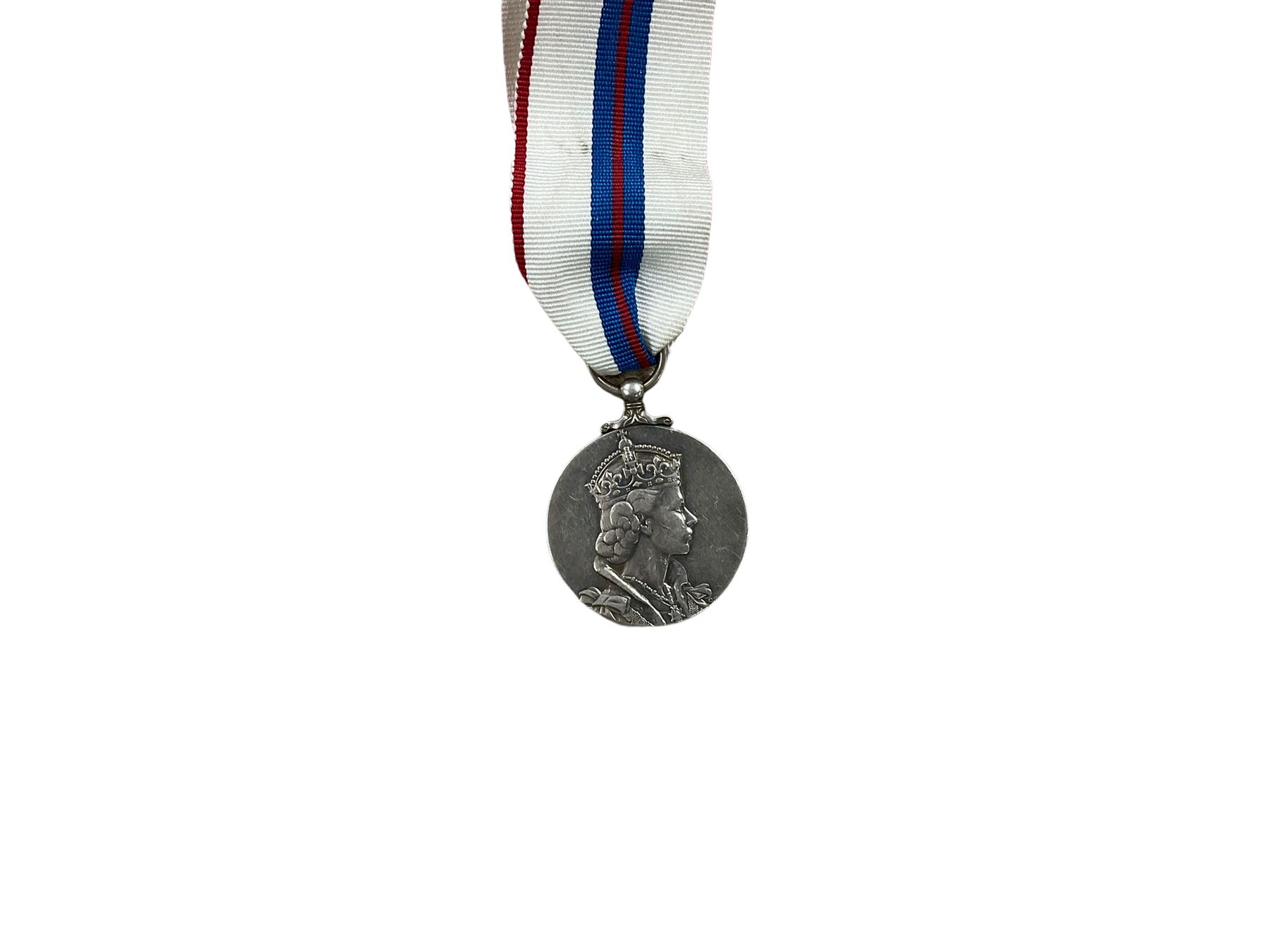 ER ll Coronation Medal, together with ribbons etc 