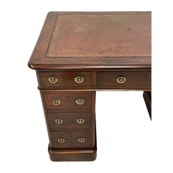 Victorian mahogany twin pedestal desk, moulded rectangular top with rounded corners and inset leather writing surface, fitted with nine drawers, on moulded plinth base