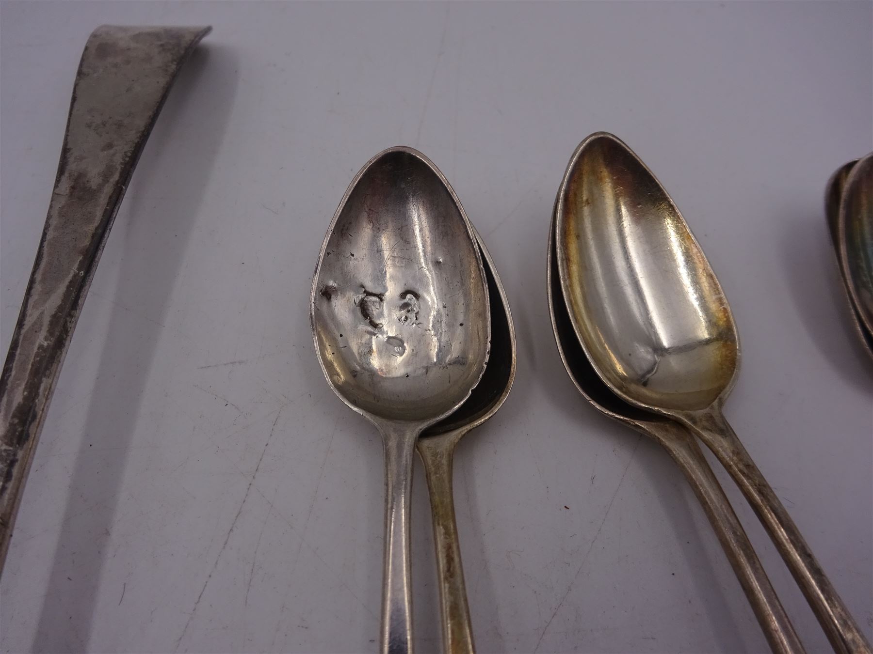 Collection of silver spoons, including Old English pattern bottom struck example, hallmarked worn and indistinct, set of six Victorian silver teaspoons, hallmarked Charles Boyton I, London 1840, a set of four George III silver teaspoons, hallmarked Charles Boyton, London 1787, and three other silver spoons 