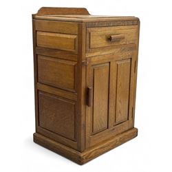 Arts & Crafts period oak bedside cupboard, raised back over moulded top, fitted with singl...