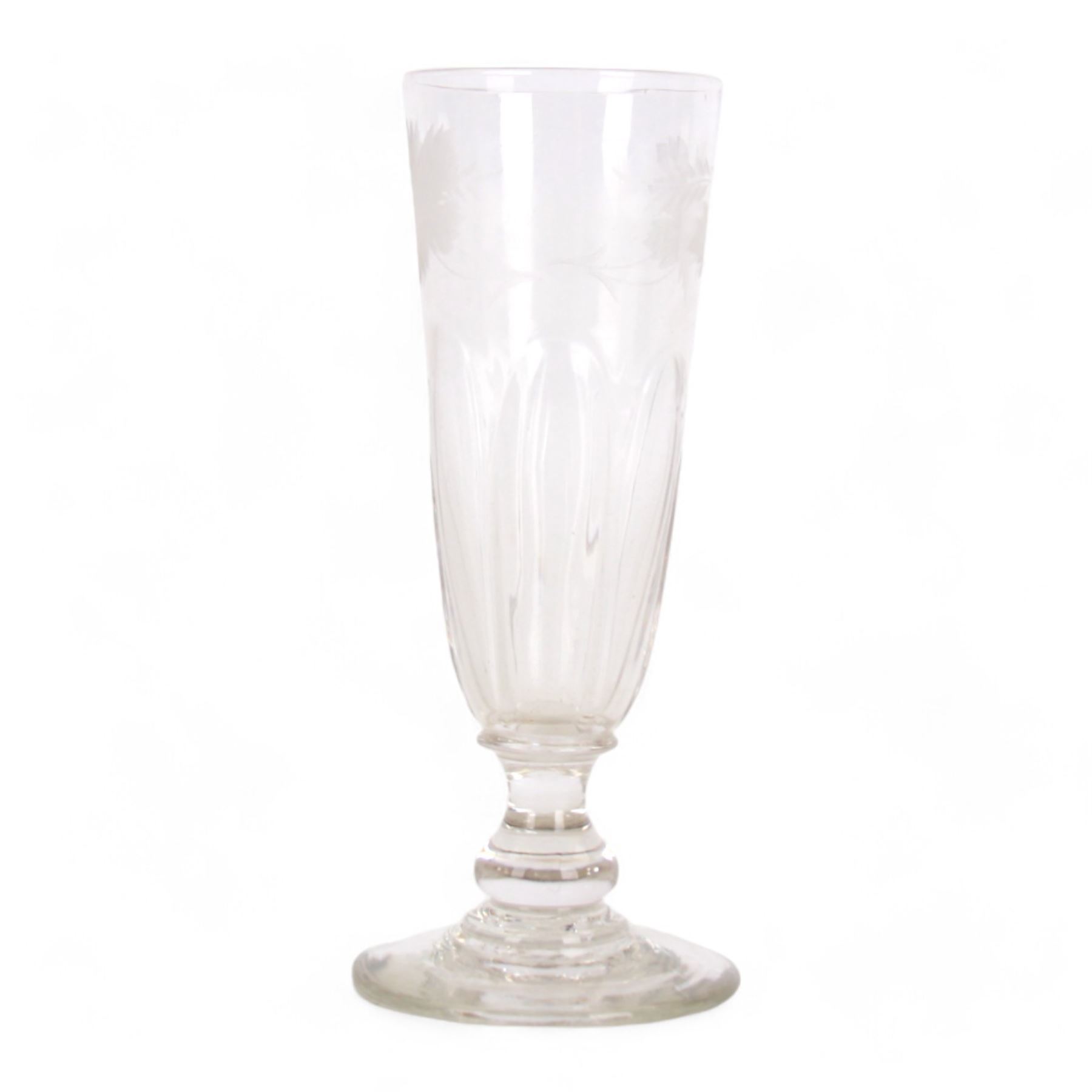 Early 19th century drinking glass, the part fluted funnel bowl engraved with leaves, upon a short knopped stem, and flat foot, H18cm