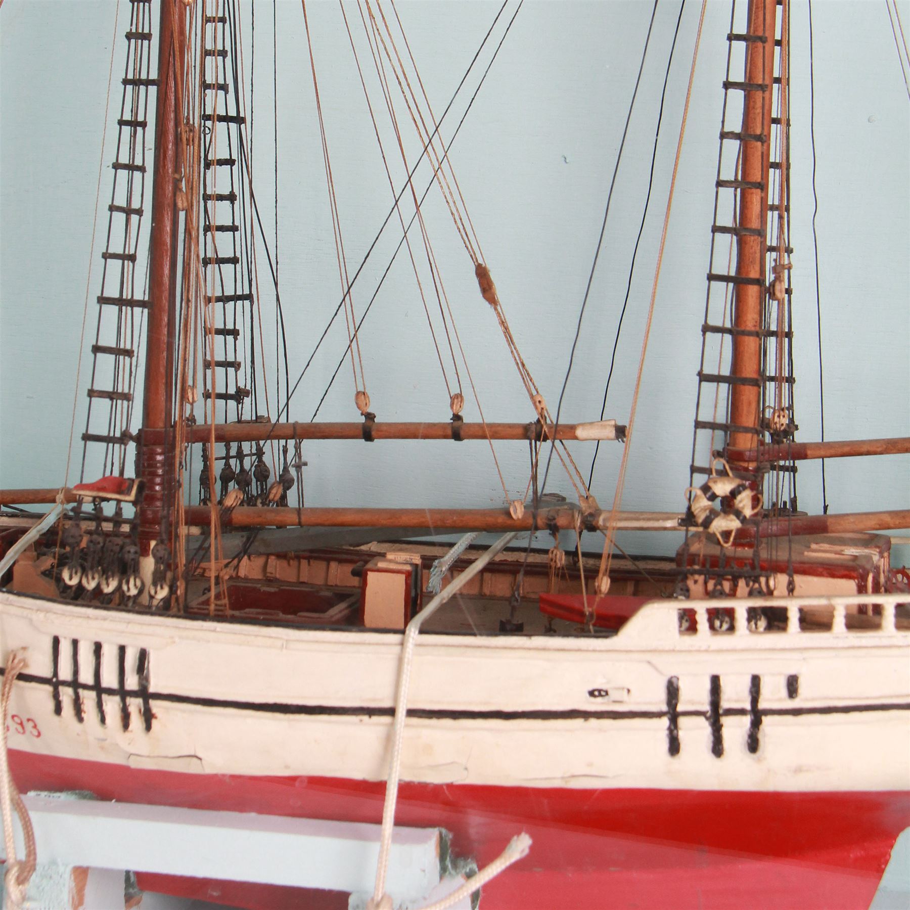 Scratch built model of a two-masted schooner, the red and white painted wooden body numbered GC-3-893, contained within wooden case, the interior painted in a light blue, with carry handle, excluding handle case H64.5cm, W67cm