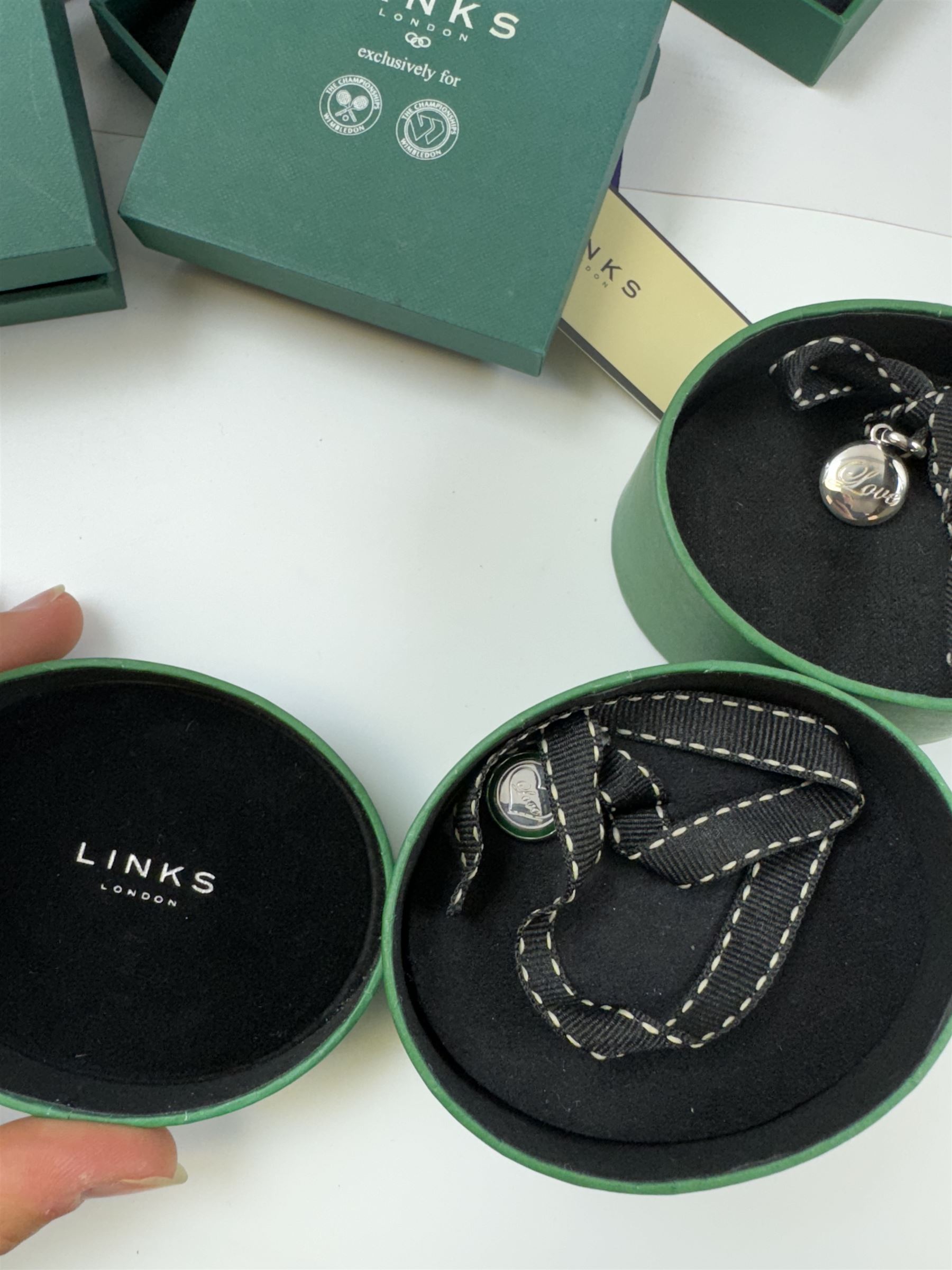 Links of London Wimbledon and tennis related jewellery to include charms, necklace, badge and keyring, including silver examples, all boxed 