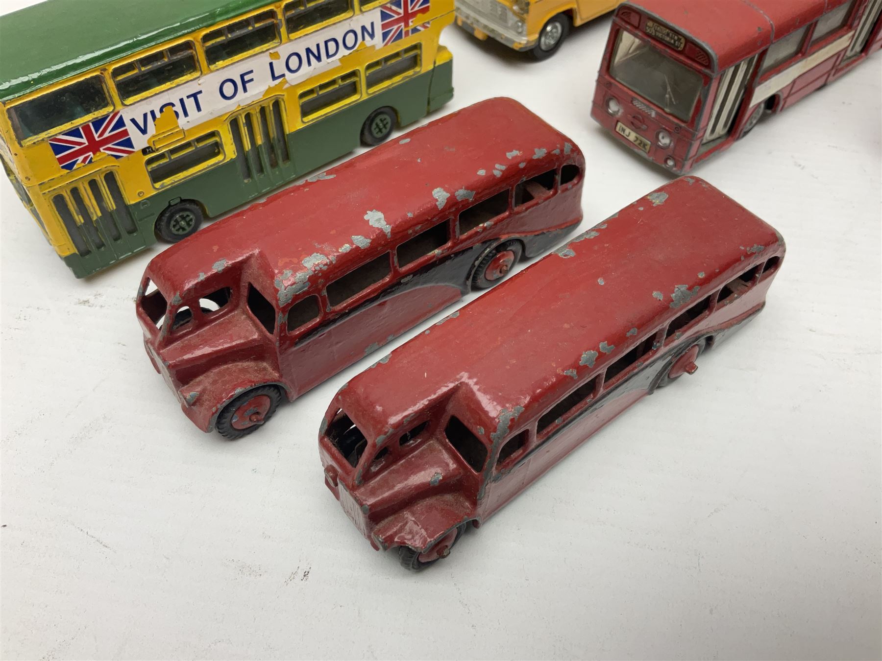 Dinky - sixteen unboxed and playworn die-cast models to include Single Deck Bus, two Atlantean Buses, Ford Transit Van, 10 Ton Army Truck, MGB Sports Car, Telephone Service Van etc 