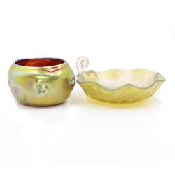 Two pieces of Austrian Art Nouveau glass, in the manner of Louis Comfort Tiffany, to include a fluted bon bon dish, with pearlescent irisdescent finish and scrolling shell handle and a small circular vase, with pinched decoration and green iridescent finish, bob bon dish D11cm