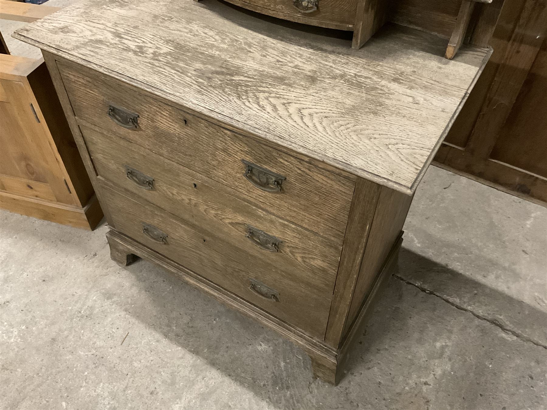 Edwardian oak dressing chest, rectangular swing back over trinket drawers, fitted with three drawers (W92cm D51cm H163cm); 20th century cupboard or bookcase, single door over four shelves (W60cm H36cm H93cm); and cupboard base - THIS LOT IS TO BE COLLECTED BY APPOINTMENT FROM THE OLD BUFFER DEPOT, MELBOURNE PLACE, SOWERBY, THIRSK, YO7 1QY