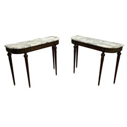 Pair of late 20th century French design mahogany console tables, D-end form with white and grey veined marble tops, the frieze rails decorated with scrolled leaf and flower head cast brass mounts, on turned and fluted supports with cast brass mounts and feet 