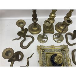 Brass inkstand, of square form, pierced, inset with blue and white ceramic inkwell to centre, together with a collation of brass candlesticks 