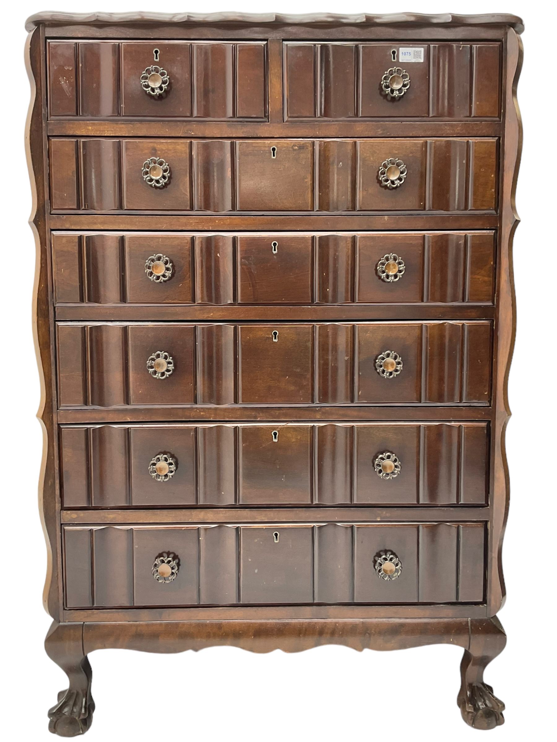 Early 20th century Dutch design mahogany chest, raised back over shaped top, fitted with two short and five long drawers, raised on ball and claw feet