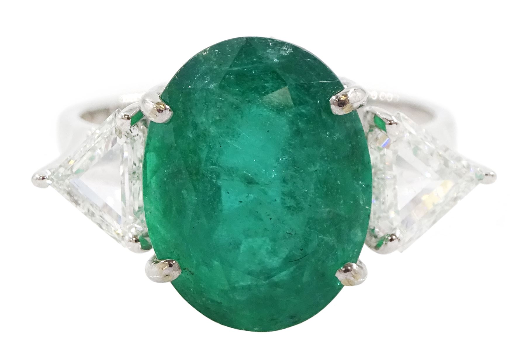 18ct white gold three stone oval cut emerald and trillion cut diamond ring, stamped, emerald approx 5.65 carat, total diamond weight approx 0.65 carat