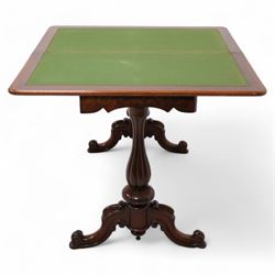 Victorian figured mahogany card table, rectangular swivel and fold-over top with rounded corners and baize lined interior, shaped apron over turned and lobe carved end supports, terminating to scroll and cartouche carved splayed supports united by swell-turned stretcher