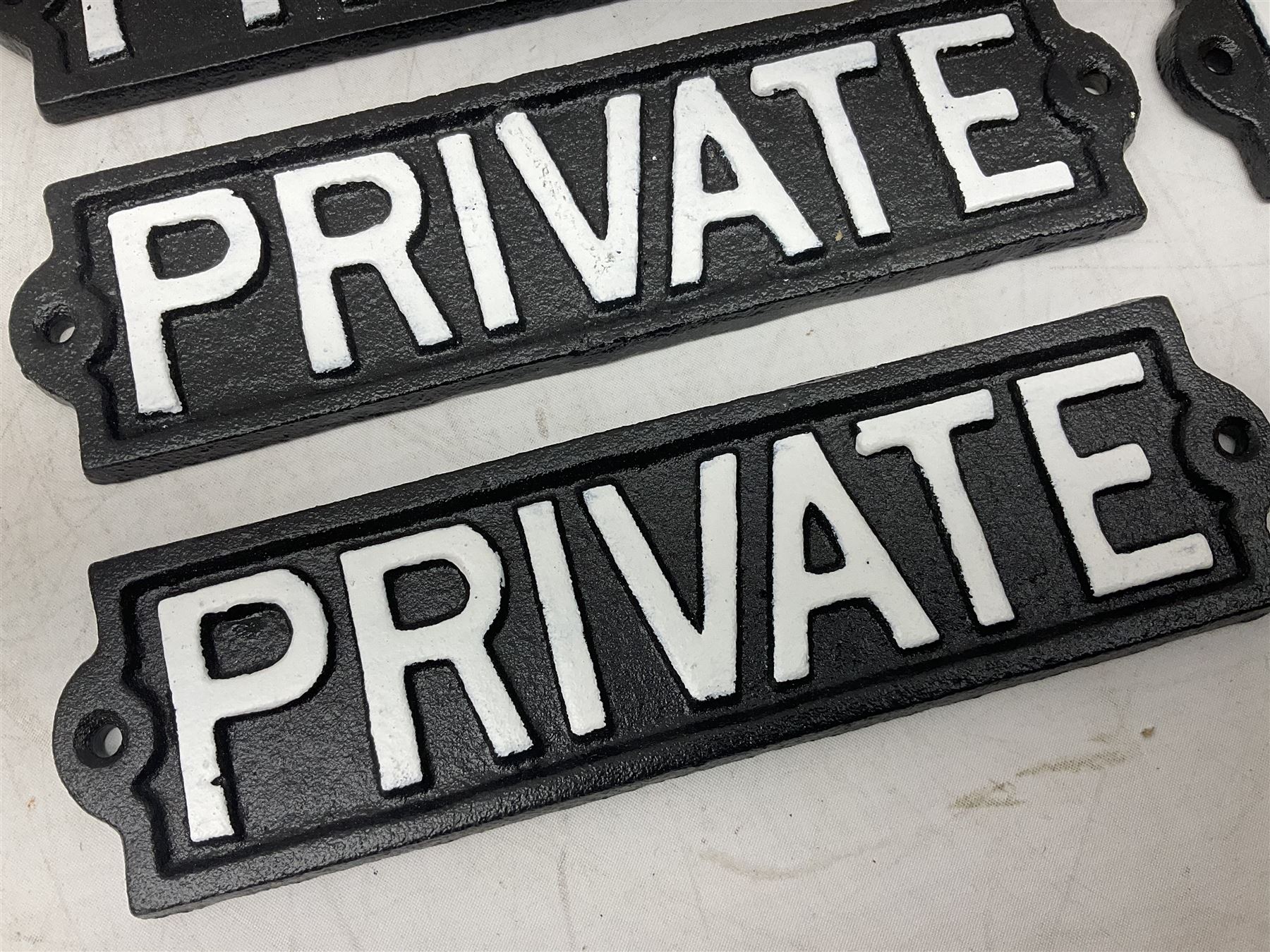 Six cast iron private signs, L21.5cm