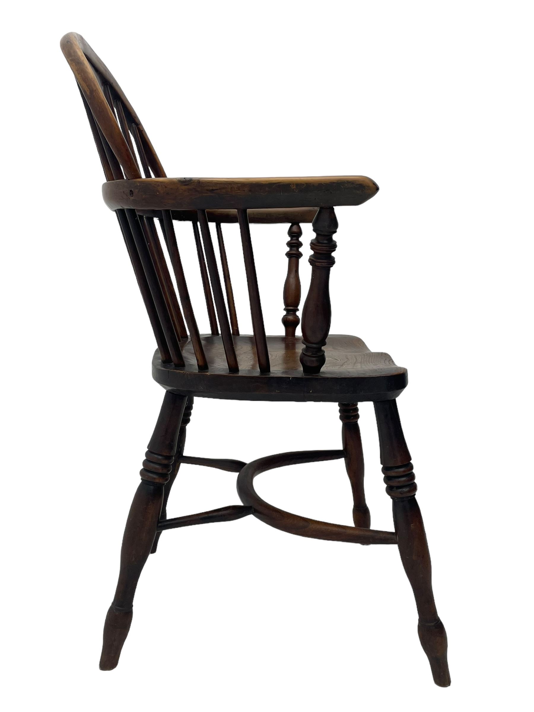 19th century yew wood and elm Windsor armchair, low double hoop stick and pierced splat back, dished seat on turned supports united by crinoline stretchers