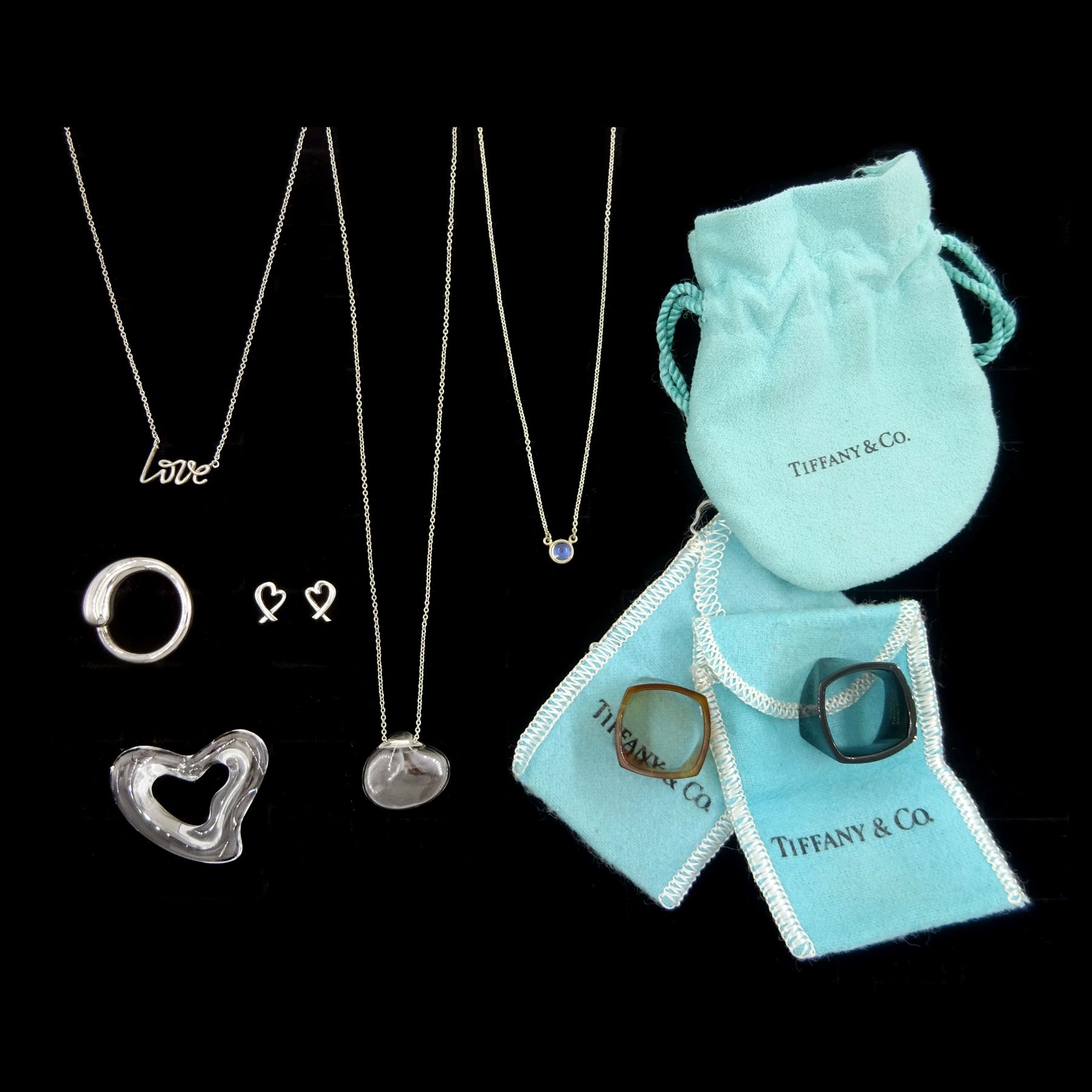 Tiffany & Co jewellery including silver Cat Island Isle rock crystal shell pendant, crystal heart pendant, silver ring and silver moonstone pendant, all designed by Elsa Peretti, two agate and black jade Torque rings designed by Frank Gehry, silver Graffiti Love necklace and Loving Heart stud earrings, designed by Paloma Picasso