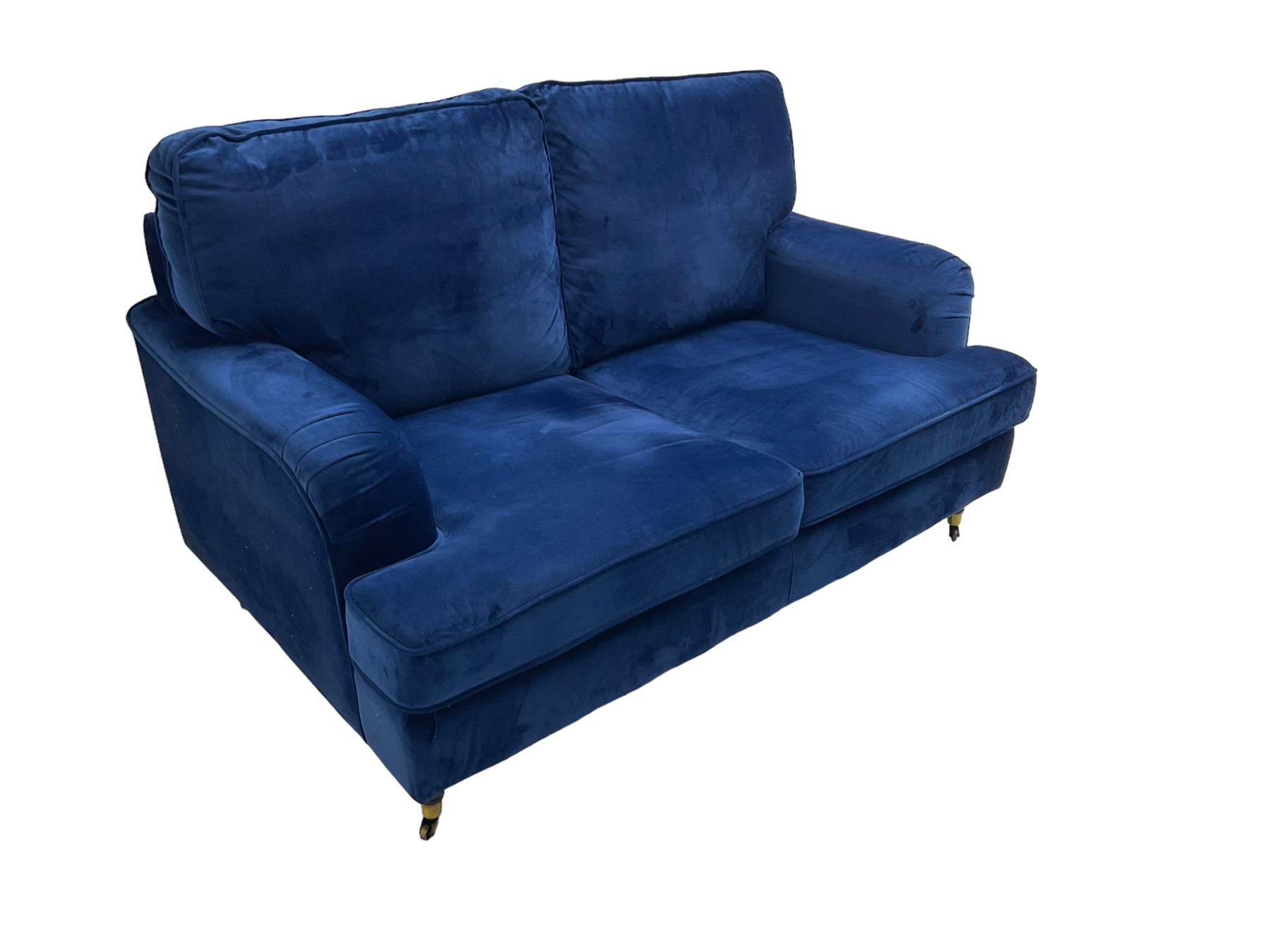 Howard design - two-seat sofa upholstered in blue fabric, traditional shape with rolled arms, on walnut finish turned feet with brushed metal cups and castors