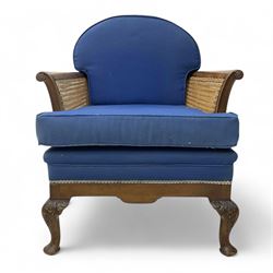 Early 20th century walnut framed bergère armchair, cane sides and back, upholstered in blu...