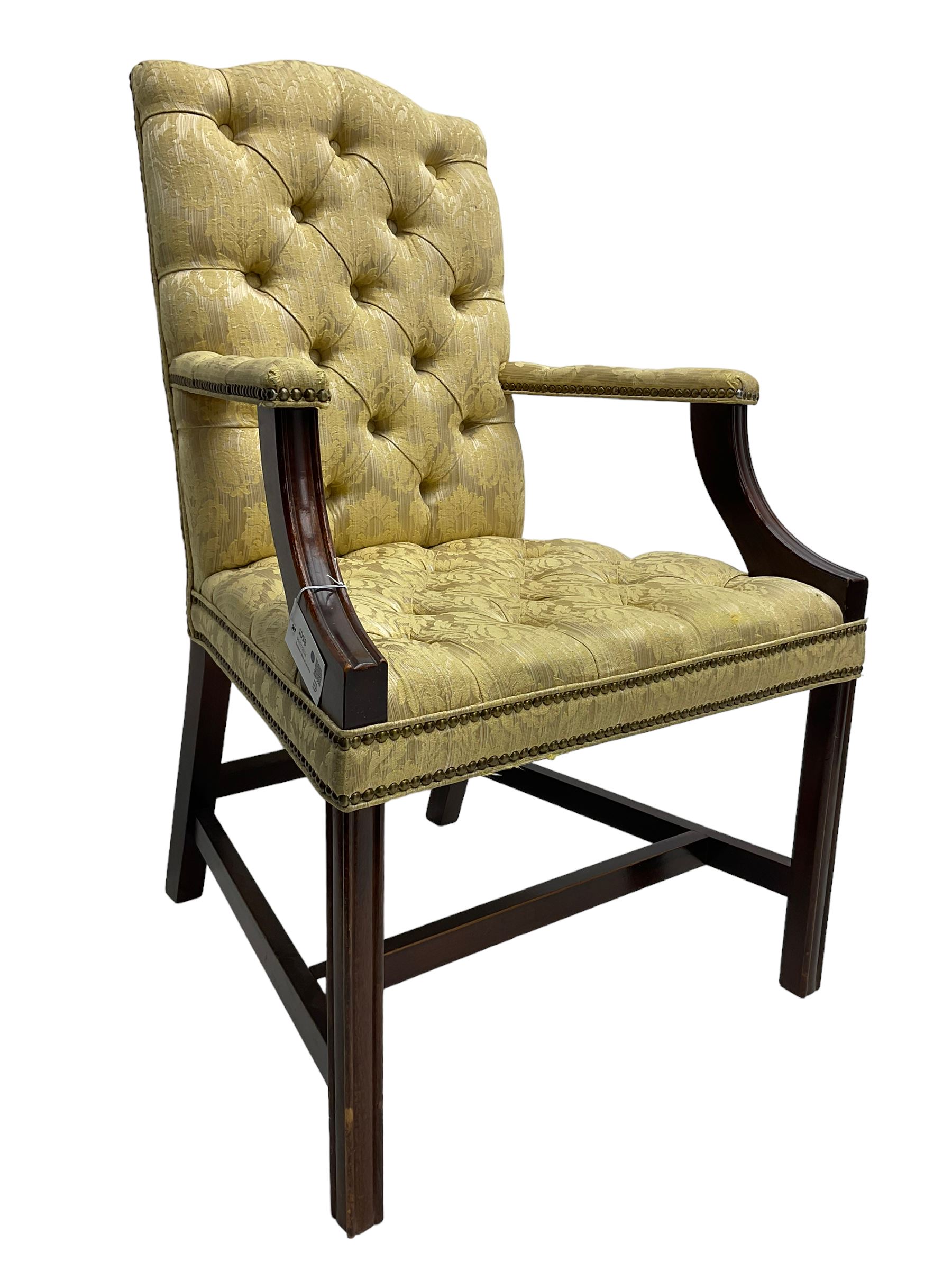 Georgian design mahogany framed Gainsborough open armchair, upholstered in pale gold buttoned fabric with floral pattern, on square moulded supports united by plain stretchers 