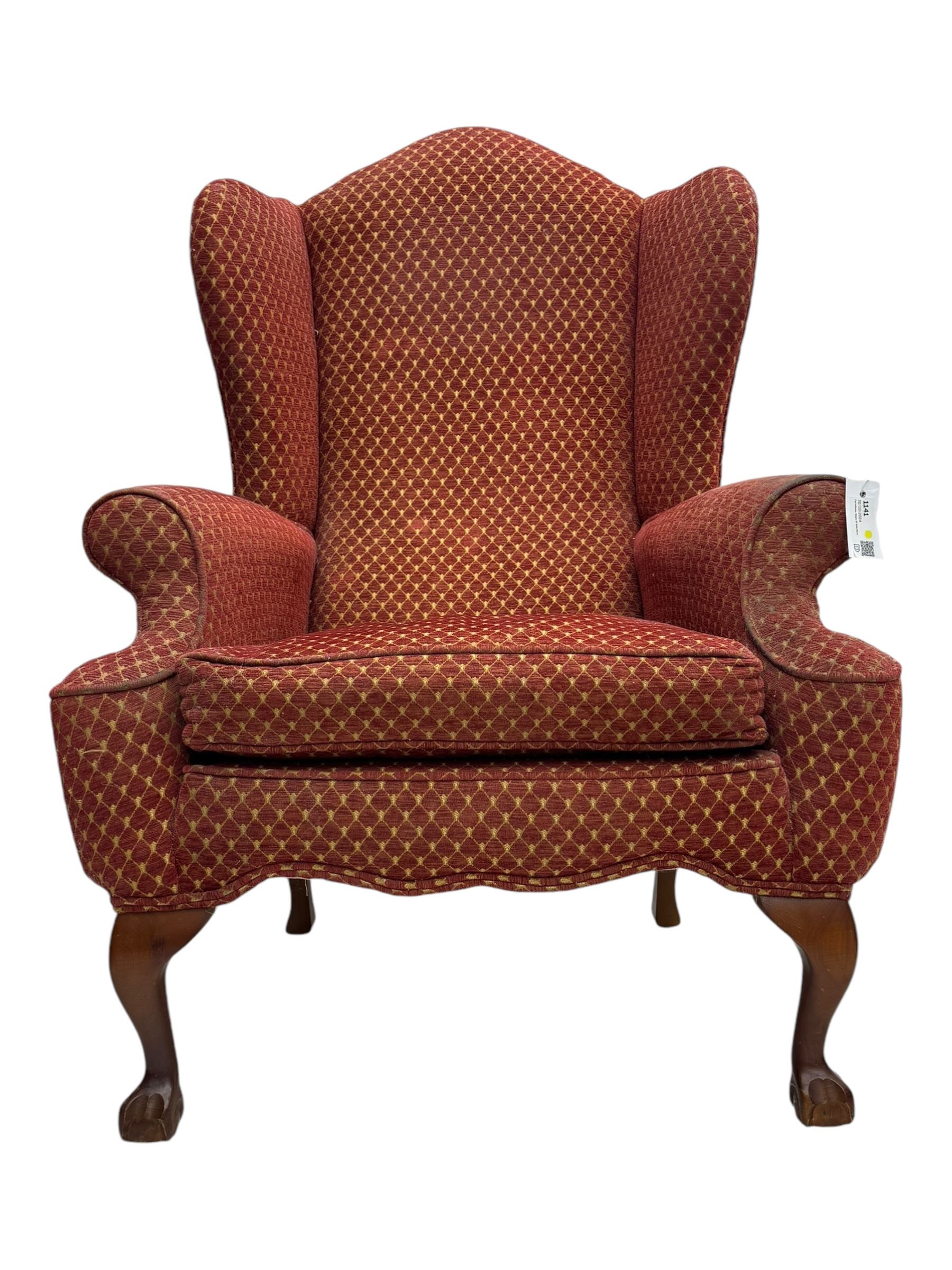 Early 20th century hardwood-framed wingback armchair, upholstered in red dotted fabric, on cabriole feet