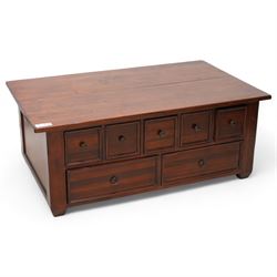 Hardwood rectangular coffee table, hinged top enclosing storage space, fitted with seven drawers 