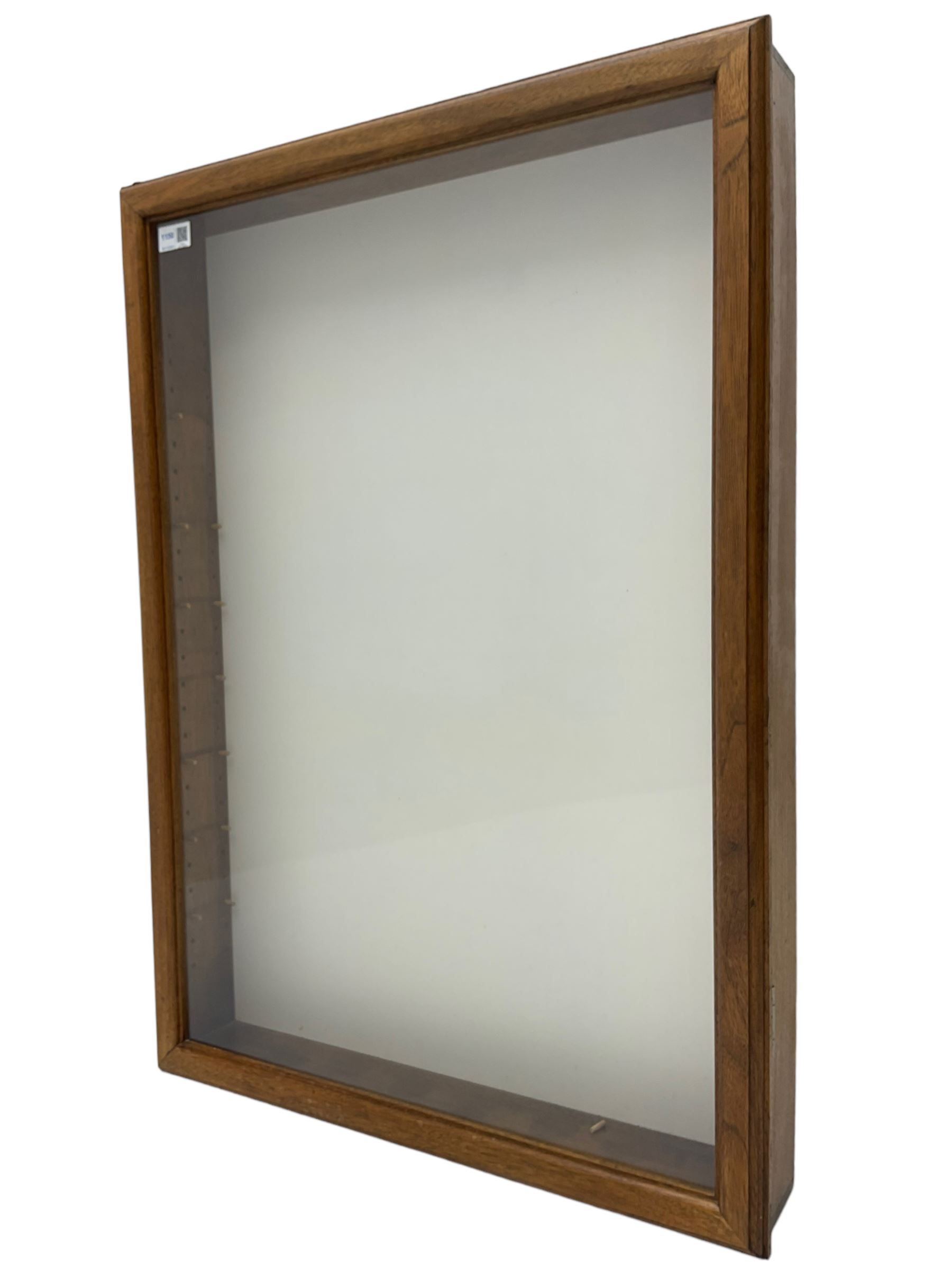 Walnut wall hanging display cabinet cabinet, enclosed by glazed door in moulded frame, fitted with glass shelves