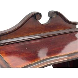 Edwardian walnut music cabinet, raised bevelled mirror back with shaped pediment, fabric lined interior with three shelves enclosed by bevel glazed doors, on shaped bracket feet