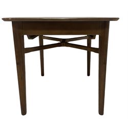 Mid-20th century teak extending dining table, rectangular top with rounded corners, raised on shaped tapering supports united by X-stretcher, with additional leaf