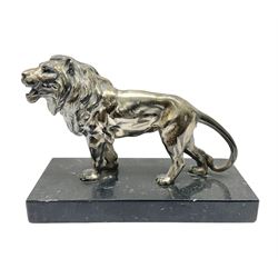 Silvered metal lion, upon a rectangular base, H12cm