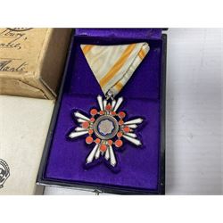 Japanese Order of the Sacred Treasure Medal (Zaihosho) in lacquered box; Norwegian Grunnlovsdag 1945 Medal with National Flag ribbon; three school attendance medals; four Royalty commemorative medals including both Victoria jubilees; quantity of medal ribbons and medal bars; medal issue boxes; badges; booklets etc